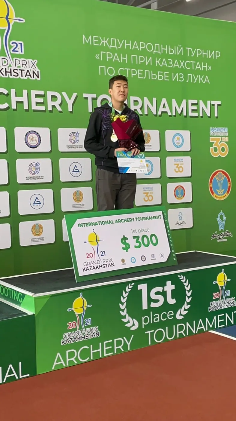 Standing on the 1st place podium at the Astana Grand Prix international archery tournament, November 2021.